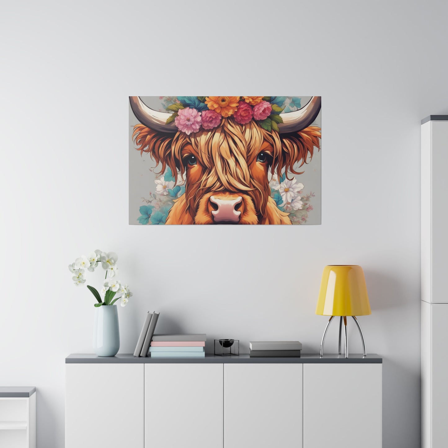 Wall art of a highland cow with a floral head piece and pastel flowers surrounding her