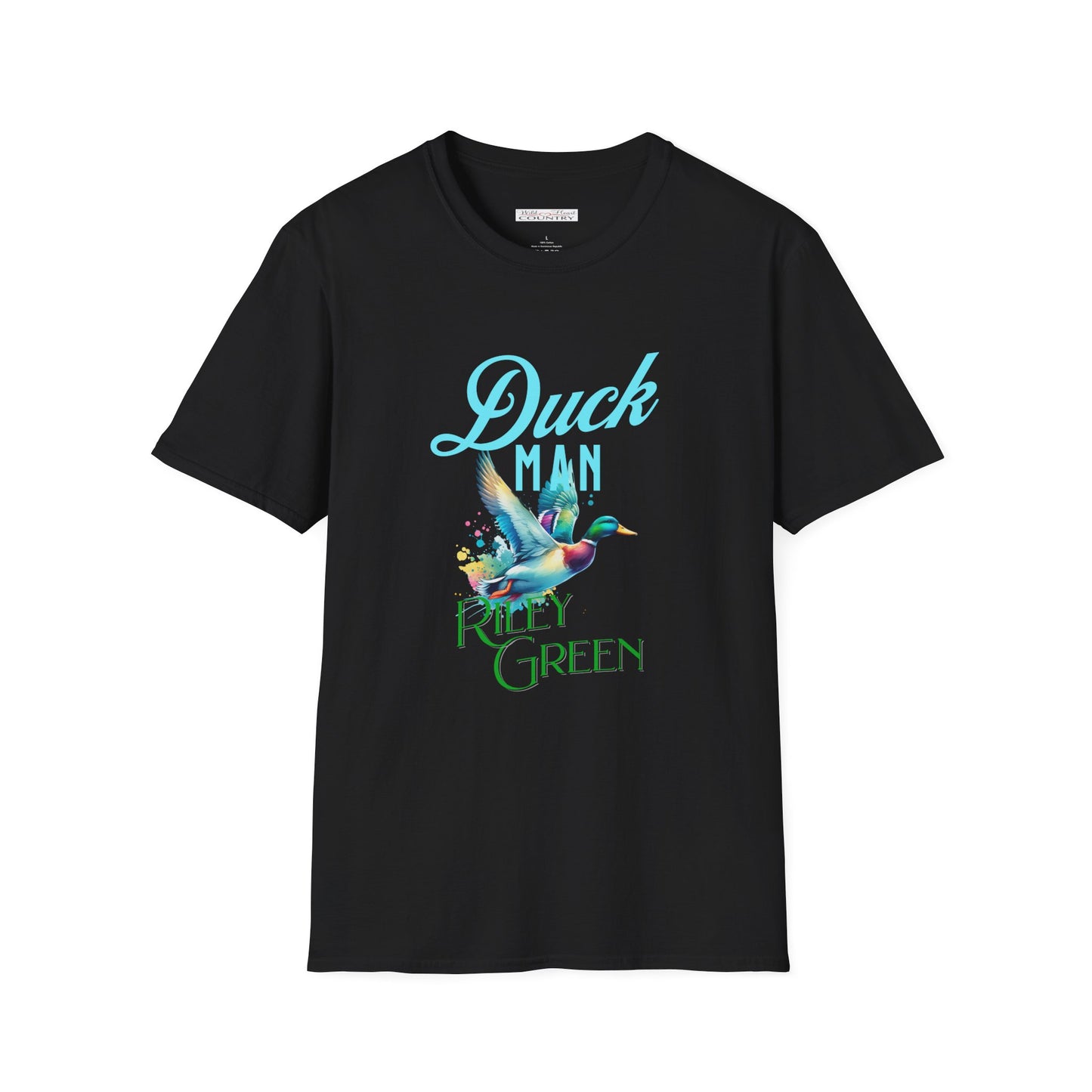 A black T-shirt with 'DUCK MAN' and 'Riley Green' text, alongside a graphic of a mallard in mid-flight, positioned on a wooden surface with sunglasses and denim shorts to the side.