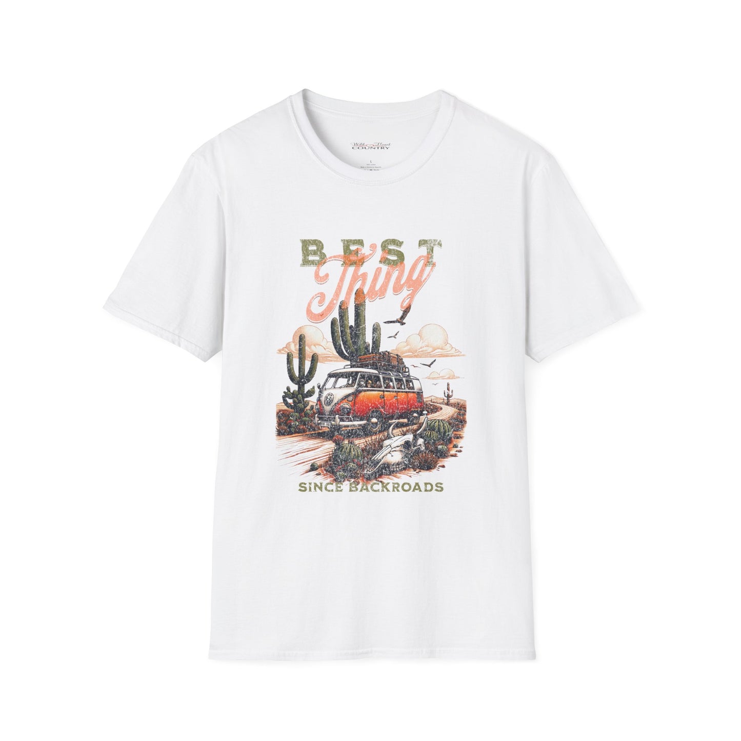 A white t-shirt with a graphic print of a vintage Volkswagen van with a surfboard on top, traveling down a dusty road with cacti on either side, and the text 'Best Thing Since Backroads' below.