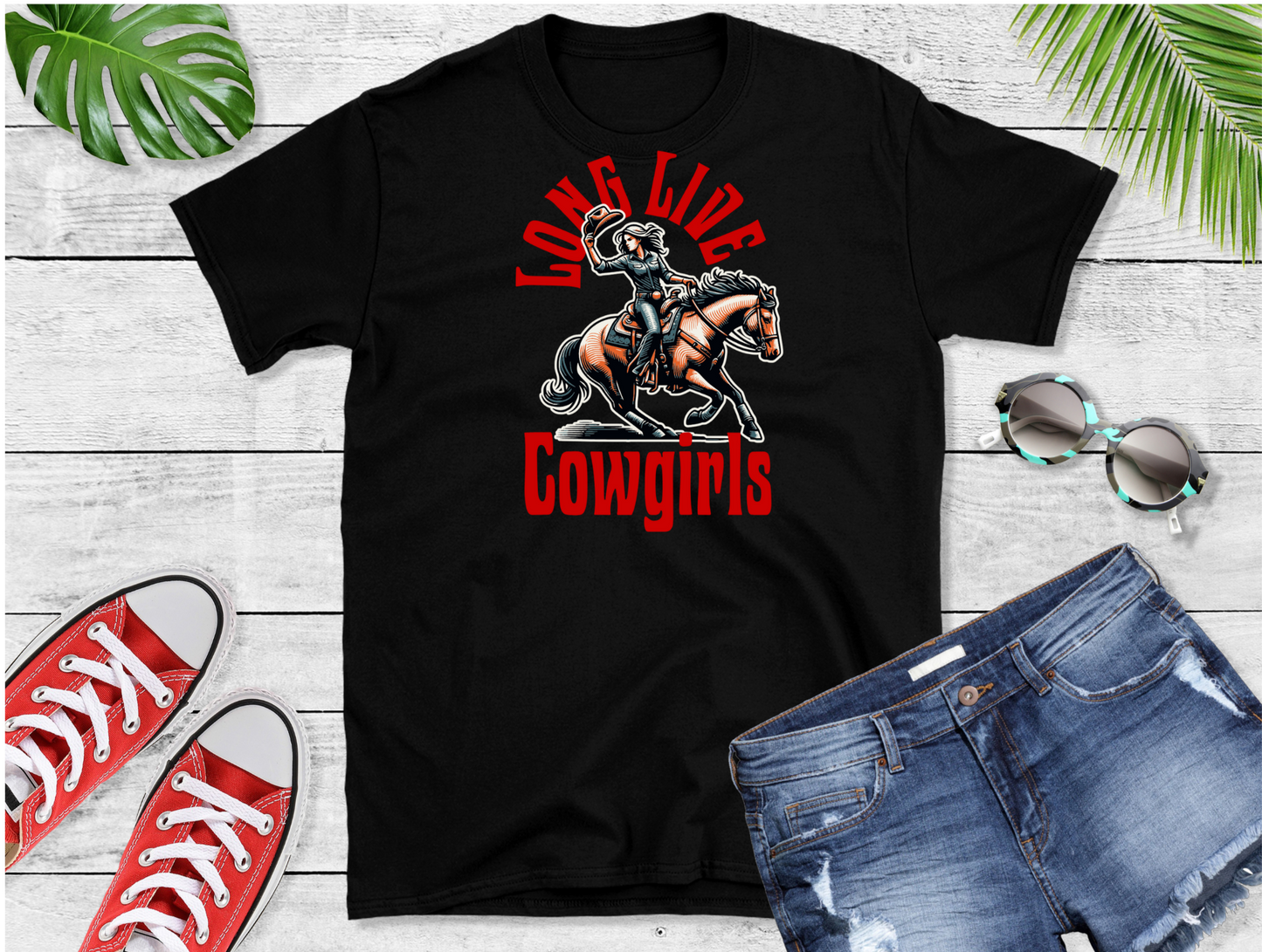Picture of a women riding a horse with red text above " Long live" and below "cowgirls"