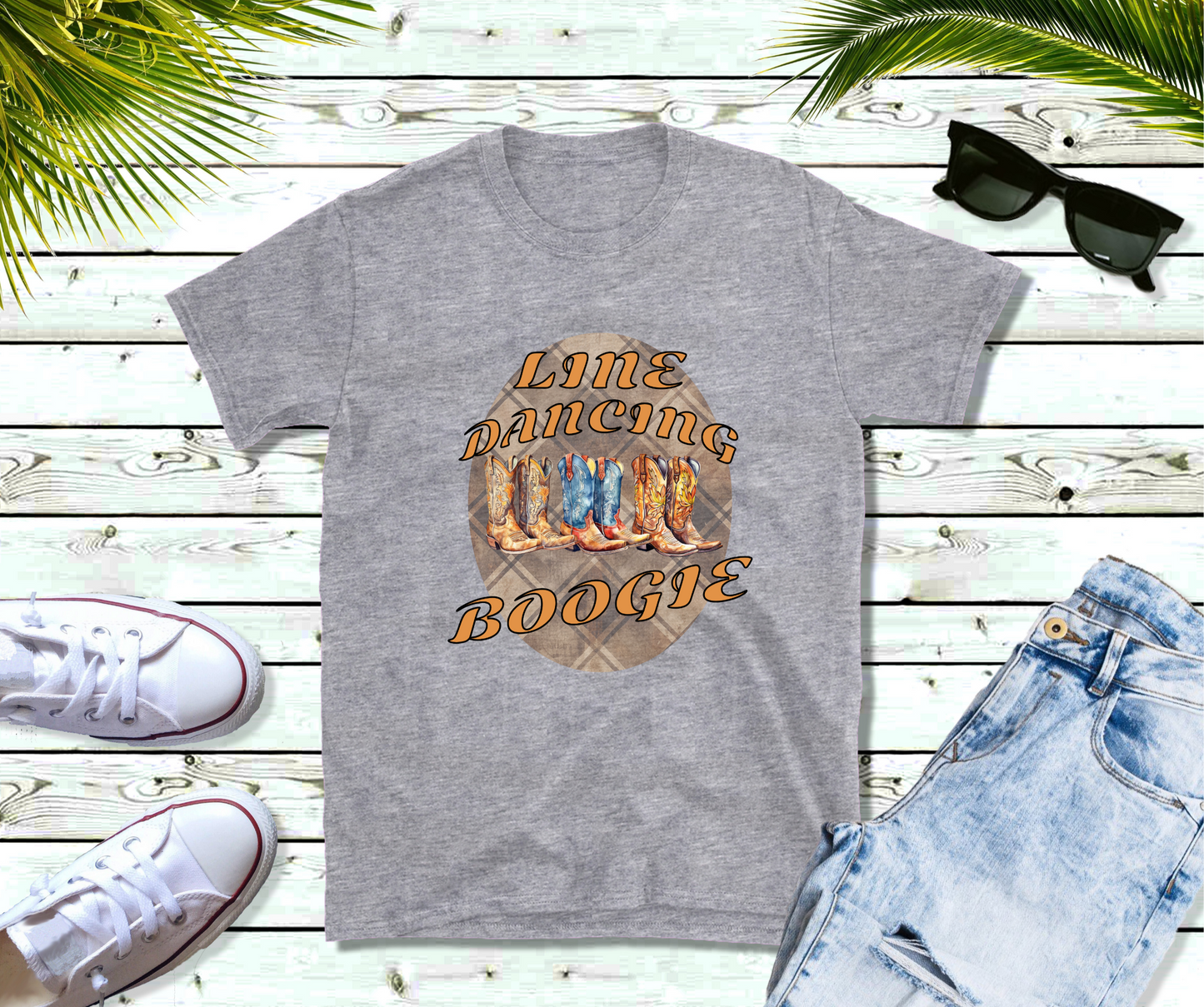 Features a central circular motif with a rustic wood grain background. At the top, bold, stylized orange text proudly declares “Line Dancing”. The centerpiece showcases four intricately patterned cowboy boots, aligned side by side, with a stunning watercolor effect. At the bottom, the same vibrant font spells “Boogie”.