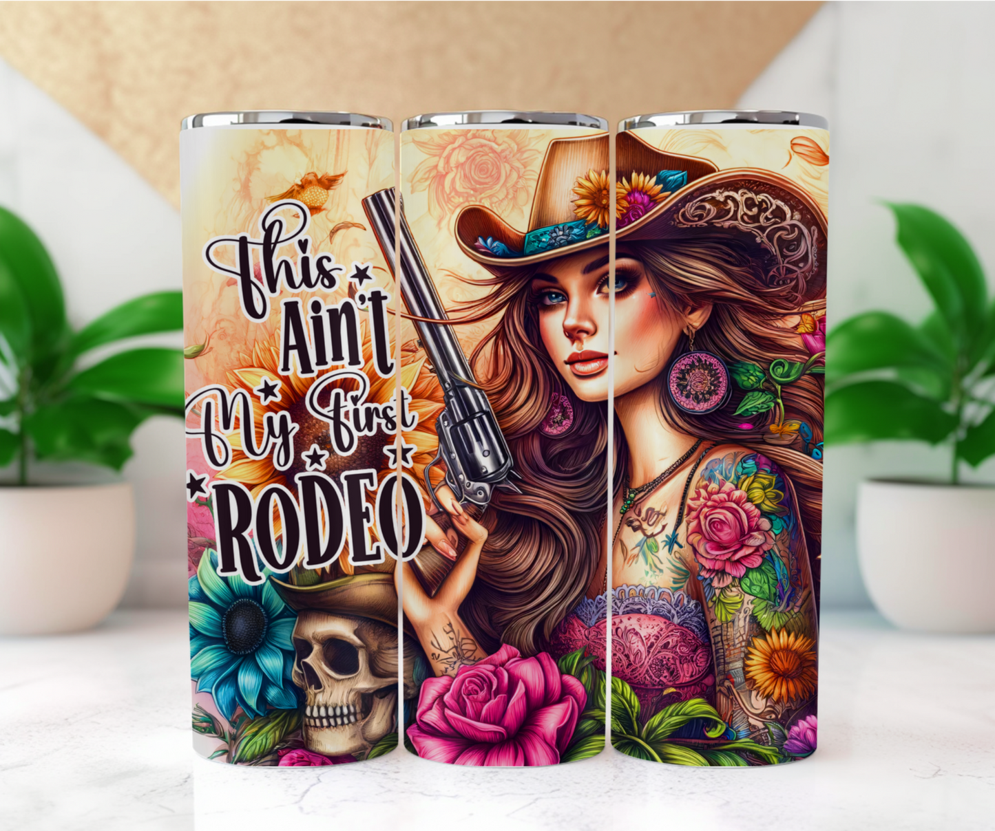 Featuring a stunning cowgirl with tattooed sleeves of colorful flowers, a hat adorned with blooming sunflowers, and a revolver in hand surround by flowers and a skull