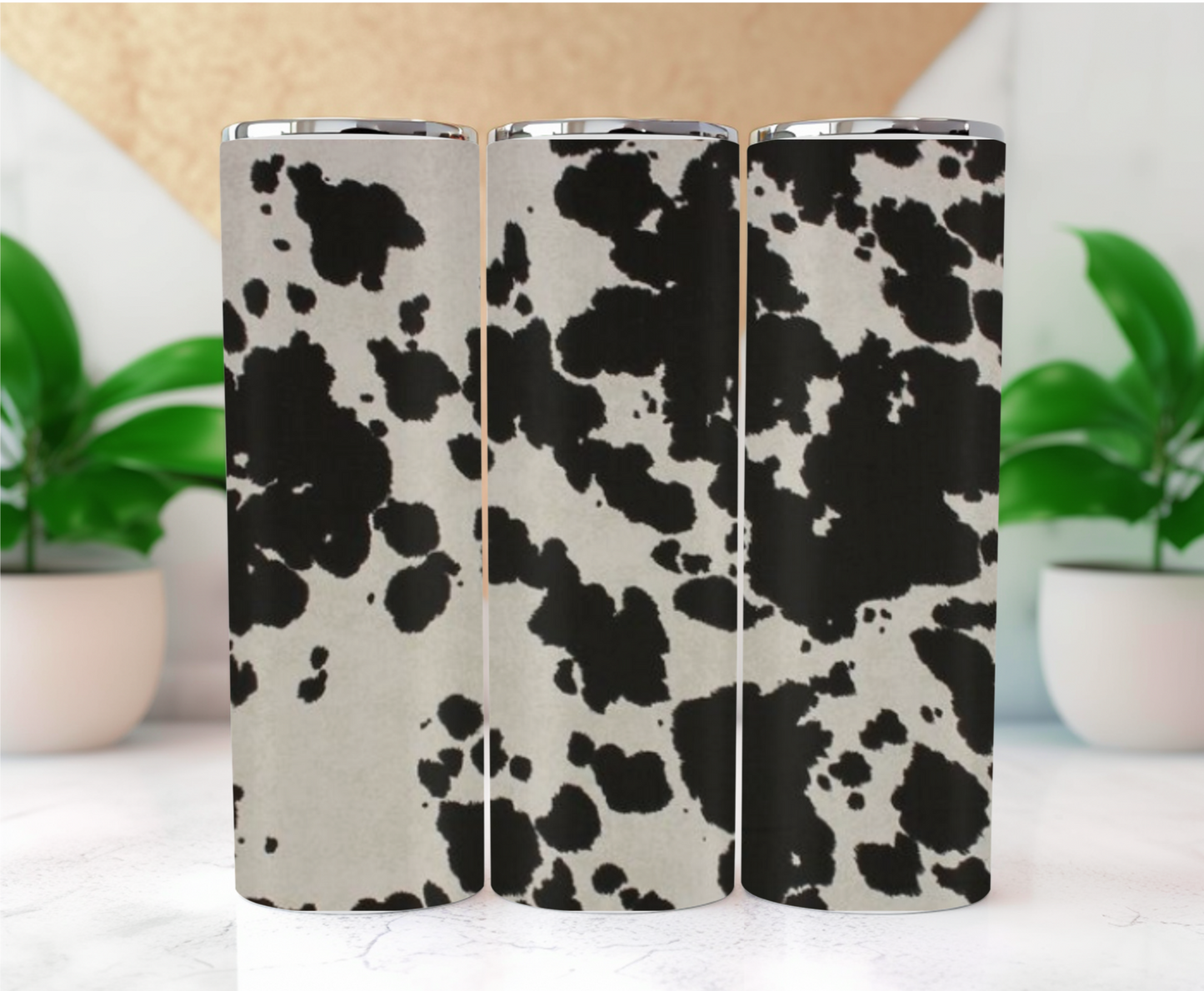 Features a classic black and white cowhide pattern, reminiscent of the iconic Holstein cow.