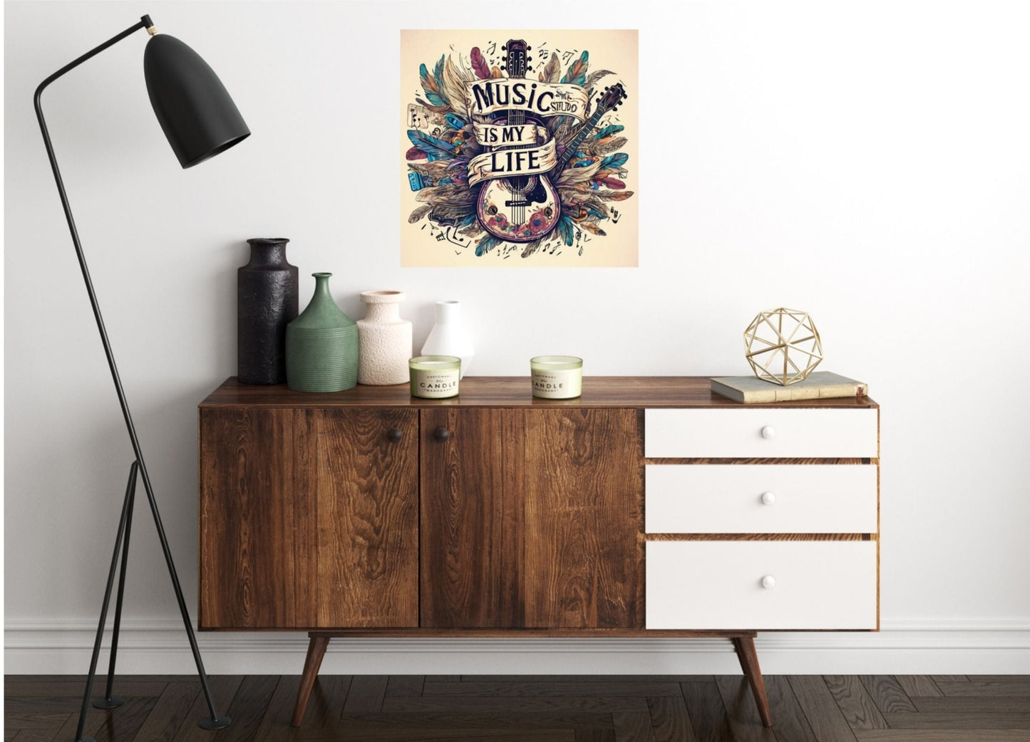 Wall art featuring blue and pink feathers with a guitar in the middle and a banner with Music is my life wrapped around the guitar