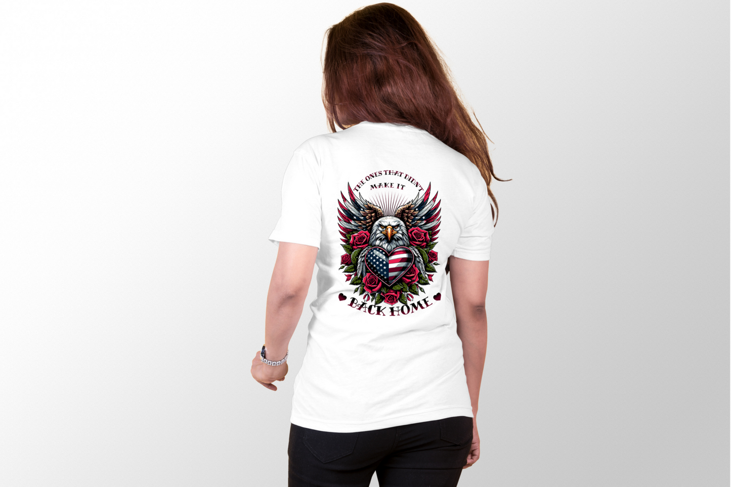 This design features a majestic eagle with its wings spread wide, in the heart of the eagle is an American flag in the shape of a heart, surrounding the eagle are red roses. The image is surrounded by the words "The ones that didn't make it back home.