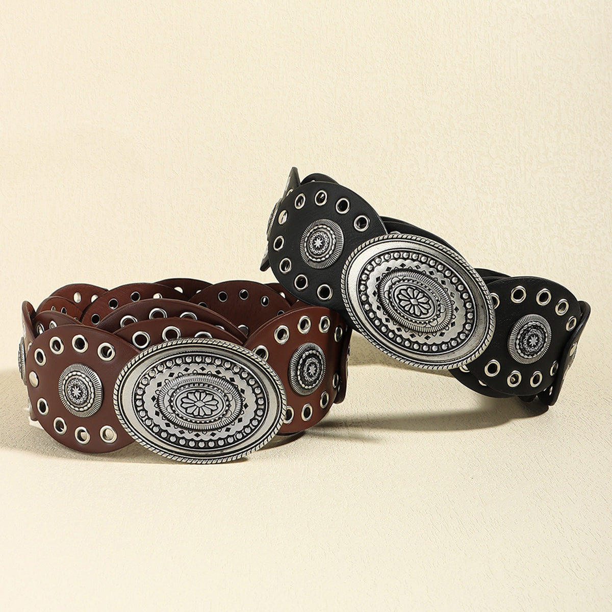 Oval buckel belt in black and brown