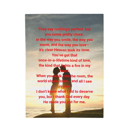 Featuring a couple kissing on a beach with the sun setting in the background and red text