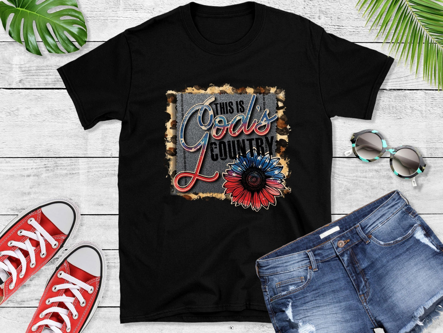 This shirt features a striking leopard print outline and a patriotic Red, White, and&nbsp;Blue theme, inspired by modern country music.