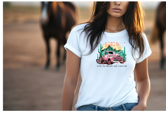 Lady wearing "Heart like a truck" Shirt in a rural setting