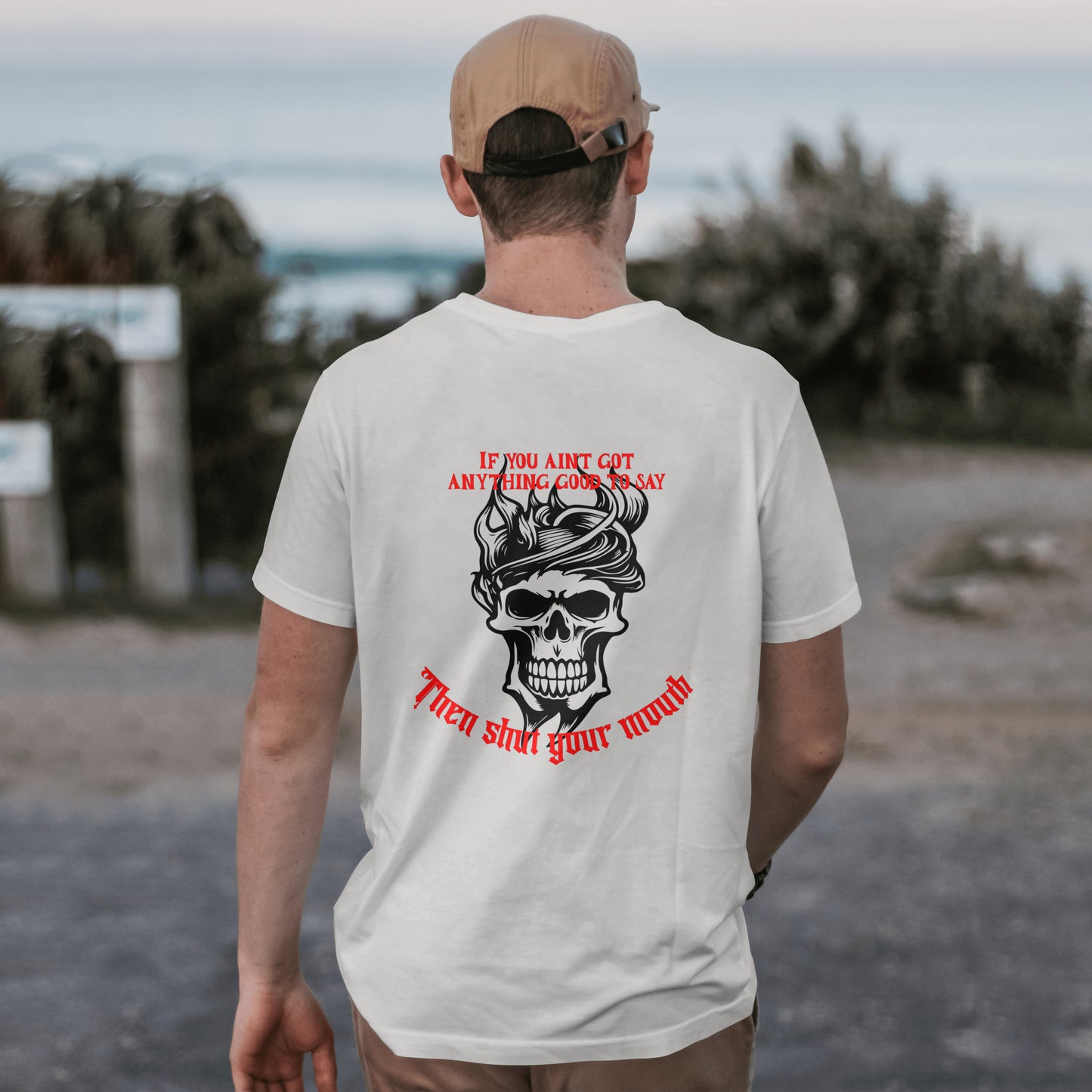 features a bold design of a black skull with a stylized flame on top of its head. Above the skull, you'll find the phrase "IF YOU AIN'T GOT ANYTHING GOOD TO SAY" in vibrant red text. Below the skull, the words "Then shut your mouth"