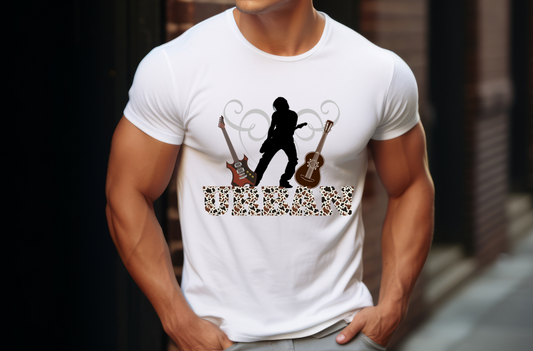 Features a striking silhouette of a guitar player in mid-performance, with two detailed guitars—one electric and one acoustic—flanking the central figure. The word “URBAN” is boldly displayed at the bottom in a unique leopard print font