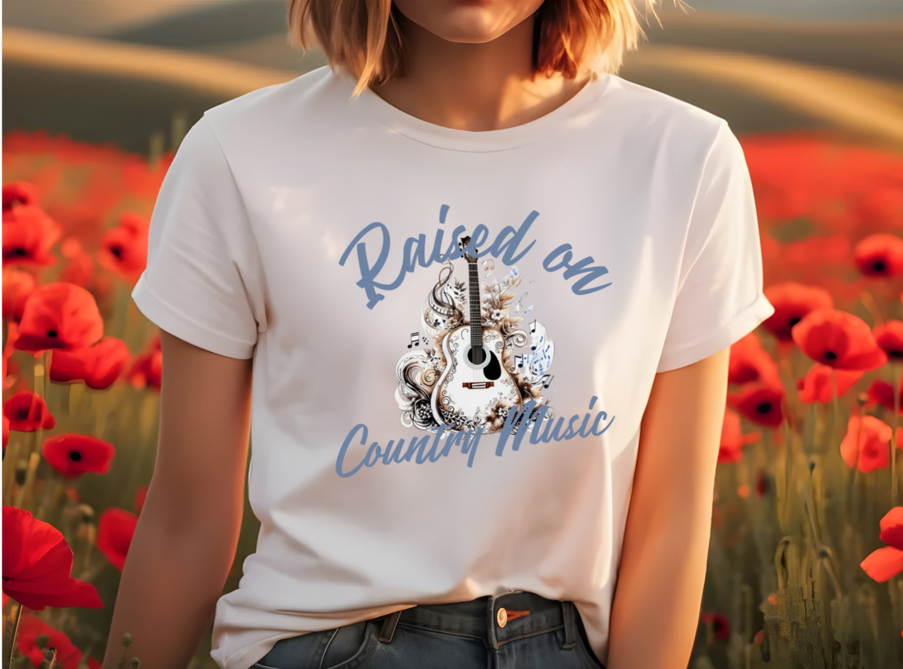 Features an intricately detailed acoustic guitar, embellished with swirling floral patterns and musical notes. The phrase "Raised on Country Music" is elegantly displayed in bold, flowing script.