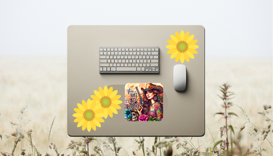 Featuring a fierce cowgirl armed with her trusty revolver and tattooed in vibrant floral ink, this mouse pad is perfect for those who like their style as bold as their attitude. Set against a backdrop of colorful sunflowers, roses, and skulls