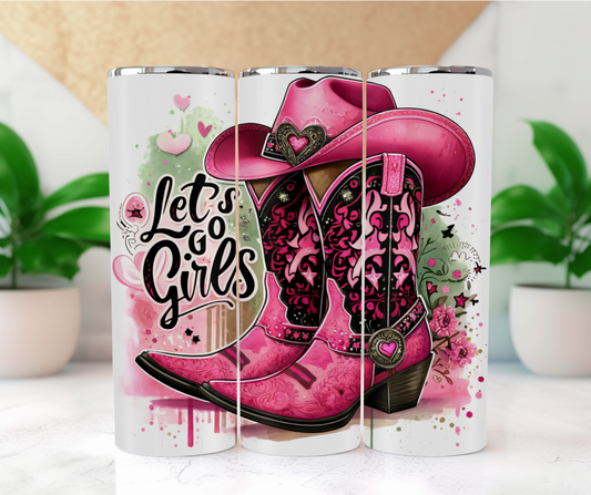 This vibrant and whimsical design features a pair of intricately detailed pink cowboy boots adorned with hearts, set against a playful background of splashes, floral patterns, and stars. The empowering phrase “Let’s go girls” is prominently displayed