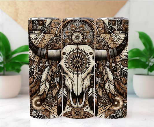 Features a powerful bull skull adorned with dreamcatcher details and surrounded by mesmerizing geometric patterns, feathers, and mandalas. Rendered in warm, earthy tones, this tumbler blends traditional southwestern motifs with a contemporary, boho-chic edge.
