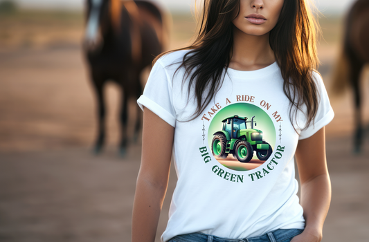 This design features a circular emblem with the inviting phrase “TAKE A RIDE ON MY” at the top and “BIG GREEN TRACTOR” at the bottom, flanked by decorative plant stalks. At the center, a tastefully abstract green tractor