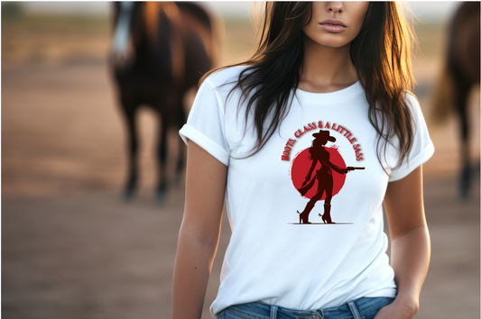 Figure of a cowgirl holding a gun and a orange circle behind her with orange text above "Boots, class & a Little Sass"